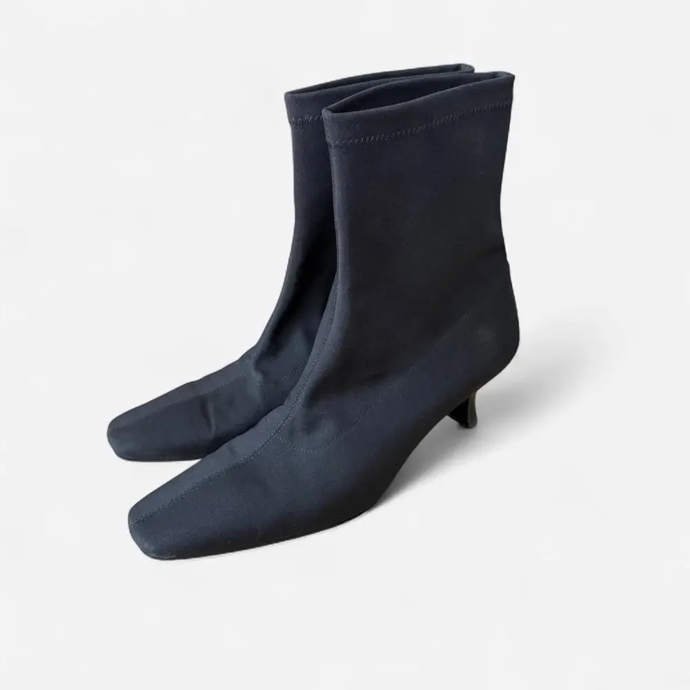 Black ankle sock boots with a kitten heel